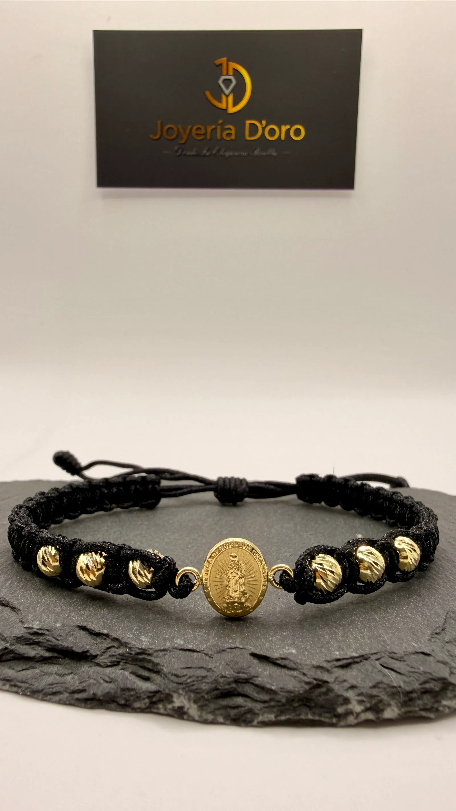 PULSERA TEJIDA NEGRA VIRGEN GUADALUPE CON 6 BOLAS / 1.41GR / ORO AMARILLO 18K
